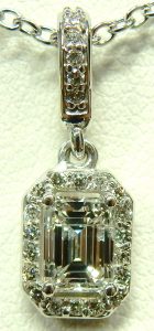 e9604 0.78ct. I1-G emerald cut pendant Stuller setting 85656