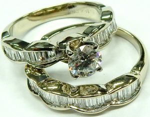 e10255 18kt. baguette and round engagement ring 001