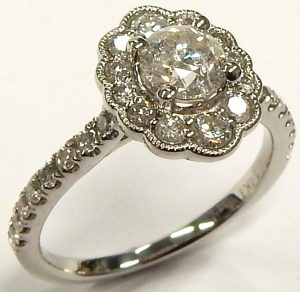 1.07 cttw. Oval Diamond Ring with Small Trio Side Diamonds Size 5.5