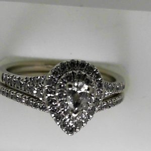 Estate Diamond Engagement Ring 
10 Karat White Estate Engagement Ring 
Finger Size 7.75 Gram Weight 4.77 
1 Center Diamond Shape: Pear With 67 Round Diamonds