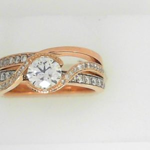 Estate Diamond Engagement Ring 
14 Karat Rosé Estate Engagement Ring 
Finger Size 6.5 Gram Weight 7.2 
1 Center Diamond 0.63ct Shape: Round; Clarity: SI2; Colour: H With 57 Round Diamonds 0.63