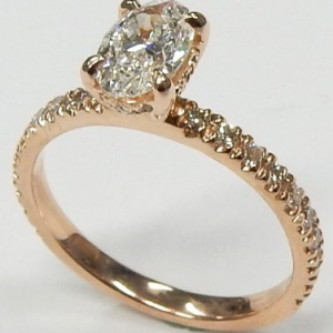 Diamond Engagement Ring 
14 Karat Rosé Engagement Ring 1twt
Finger Size 6 Gram Weight 2.8gram weight Width: 2.1 
1 Center Diamond 0.70ct Shape: Oval Clarity: I1 Colour: H With 32 Round Diamonds 0.30 ctw 1