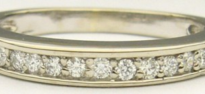 Estate Diamond Anniversary Ring 
14 Karat White Estate Anniversary Ring 
Finger Size 5.5 Gram Weight 2.6 
14 Center Diamonds Shape: Round; Clarity: VS1; Colour: G/H 0.17