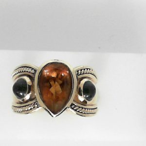 Citrine Estate Ring 
14 Karat Yellow Citrine Ring With Finger Size 6.5 
 Gram Weight 14 
1 Center Citrine Shape: Pear With 2 Cabochon Tourmalines