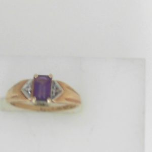 Amethyst Estate Ring 
10 Karat Yellow Amethyst Ring With Finger Size 5.25 
 Gram Weight 1.85 
1 Center Amethyst Shape: Emerald With 2 Round Diamonds