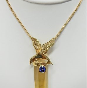 Beryl Estate Pendant 
14 Karat Yellow Beryl Pendant 
 Chain Style: Foxtail 14 Karat Yellow Length: 24in 
1 Center Beryl Shape: Fantasy Cut With 1 Round Tanzanite 1.00 ctw and 18 Round Diamonds 0.18 ctw