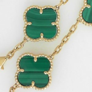 Bracelet with Malachites 
14 Karat Yellow Malachites Bracelet Length: 7in 
Gram Weight 11.16 
5 Center Malachites Shape: Various Shapes