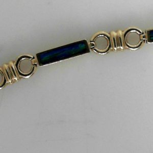 Estate Bracelet With Created Opals 
14 Karat Yellow Created Opals Bracelet Length: 7.5in 
Gram Weight 12.27 
6 Center Created Opals Shape: Various Shapes