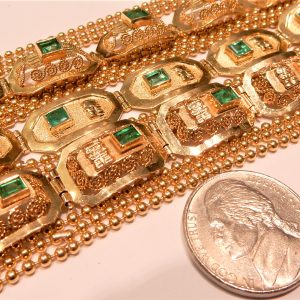 Estate Bracelet With Emeralds 
18 Karat Yellow Bluish Green Emeralds Bracelet Length: 8.5in 
Gram Weight 120 
27 Center Emeralds Shape: Fantasy Cut; Colour: Bluish Green