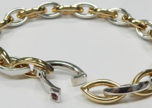 Estate Bracelet With Ruby 
18 Karat Yellow/White Ruby Bracelet Length: 7in 
Gram Weight 15.4 
1 Center Ruby Shape: Round