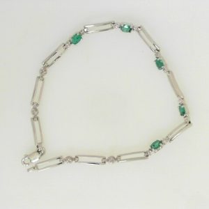 Estate Bracelet With Emeralds 
14 Karat White Emeralds Bracelet Length: 7in 
Gram Weight 3.99 
5 Center Emeralds Shape: Oval