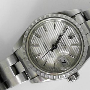 Estate Rolex Dress Year: 2003
Vendor Style #: 79240 DateJust 26 Tapestry SN: F4422066 Oyster
26mm StainlessSteel
Dial: Silver tapestry hash 
Box Included/Papers Included
Condition Good
1 Year Warranty