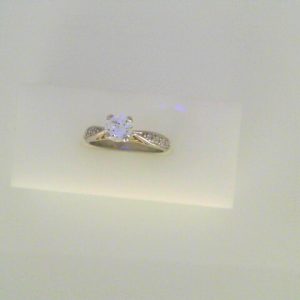 Diamond Engagement Ring
22K/Platinum Yellow/White Engagement Ring 0.67twt
Finger Size 6 Gram Weight 4.6gram weight Width: 2.3
1 Center Diamond 0.51ct Shape: Round Clarity: SI1 Colour: G With 10 Round Diamonds 0.16 ctw 0.67