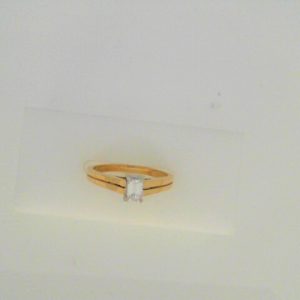 Diamond Engagement Ring 
14 Karat Yellow/White Engagement Ring 0.27twt
Finger Size 6.5 
1 Center Diamond 0.27ct Shape: Emerald Clarity: VS1 Colour: F/G 0.27
