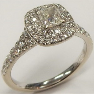 Estate Diamond Engagement Ring 
14 Karat White Estate Engagement Ring 
 Gram Weight 2.58 
1 Center Canadian Diamond 0.30ct Shape: Princess; Clarity: I1; Colour: I With 52 Round Diamonds 0.30 ctw 0.6