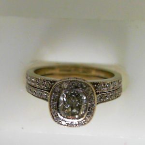 Estate Diamond Engagement Ring 
14 Karat White Estate Engagement Ring 
Finger Size 6.5 Gram Weight 5.1 
1 Center Diamond 0.60ct Shape: Cushion; Clarity: VS1; Colour: I With 70 Round Diamonds 0.56 ctw 1.16