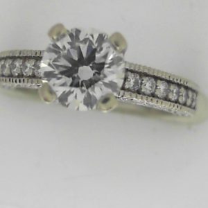 Estate Diamond Engagement Ring 
14 Karat White Estate Engagement Ring 
Finger Size 4 Gram Weight 3.9 
1 Center Diamond 0.90ct Shape: Round; Clarity: SI1; Colour: F; GIA 1172057559 With 26 Round Diamonds 0.50 ctw 1.4