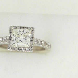 Estate Diamond Engagement Ring 
14 Karat White Estate Engagement Ring 
Finger Size 4.75 Gram Weight 2.79 
1 Center Diamond 0.95ct Shape: Princess; Clarity: VS; Colour: K/L With 14 Round Diamonds 0.36 ctw and 24 Round Diamonds 0.06 ctw 1.37