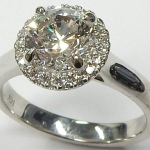 Estate Diamond Engagement Ring 
14 Karat White Estate Engagement Ring 
Finger Size 6 Gram Weight 4.1 
1 Center Diamond 1.60ct Shape: Round; Clarity: I1; Colour: H With 20 Round Diamonds 0.20 ctw 1.8