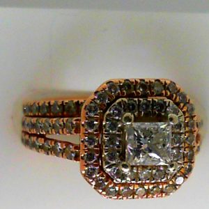 Estate Diamond Engagement Ring 
14 Karat Rosé Estate Engagement Ring 
Finger Size 4.75 Gram Weight 5.9 
1 Center Diamond 0.50ct Shape: Princess; Clarity: I2; Colour: I With 84 Round Diamonds 0.5