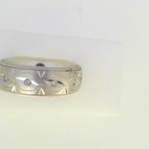 Diamond Ring- Men's 
10 Karat White Men's Diamond Ring 
Finger Size 10 Gram Weight 8.1 
 Center Diamond Shape: Round