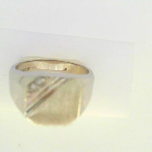 Diamond Ring- Men's 
14 Karat White Men's Diamond Ring 
Finger Size 10.5 Gram Weight 9.79 
 Center Diamond Shape: Round 0.03