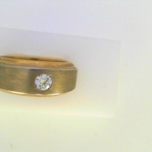 Diamond Ring- Men's 
10 Karat Yellow/White Men's Diamond Ring 
Finger Size 8 
1 Center Diamond 0.20ct Shape: Round 0.2