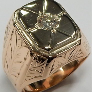 Estate Diamond Ring - Men's
14k/18K Rose/White Estate Diamond Ring Width 6mm
Finger Size 9.75 Gram Weight 23.8
1 Center Diamond 0.50ct Shape: Round; Clarity: SI1; Colour: I 0.5