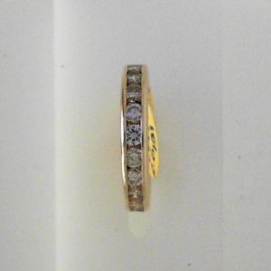Estate Diamond Anniversary Ring 
14 Karat Yellow Estate Anniversary Ring Width 3.4mm 
Finger Size 5.25 Gram Weight 2.6 
12 Center Diamonds Shape: Round 0.75