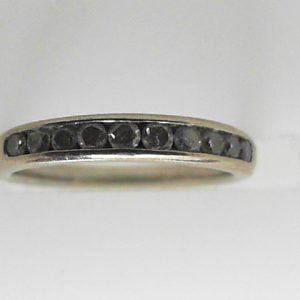 Estate Diamond Anniversary Ring 
10 Karat White Estate Anniversary Ring 
Finger Size 3 Gram Weight 1.3 
10 Center Diamonds Shape: Round 0.2