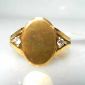 Diamond Dinner Ring - Women's 
10 Karat Yellow Dinner Ring 
Finger Size 6.75 Gram Weight 5.76 
 Center Diamond Shape: Round 0.1