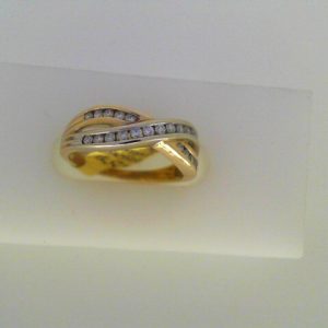 Estate Diamond Dinner Ring - Women's 
10 Karat Yellow/White Estate Dinner Ring Width 1.6mm 
Finger Size 5.5 Gram Weight 2.88 
23 Center Diamonds Shape: Round 0.25