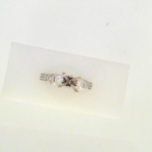 Diamond Semi-Mount Ring
14 Karat White Ring
Finger Size 6.75 Gram Weight 5.65
Center Diamond Shape: Round; Clarity: VS1; Colour: F/G 0.82