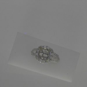 Diamond Semi-Mount Ring
14 Karat White Ring
Finger Size 6.5 Gram Weight 4.75
Center Diamond Shape: Round; Clarity: VS-SI; Colour: F/G Baguette Diamond 0.12 ctw 0.82