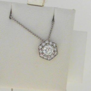 Diamond Pendant/Necklace 
14 Karat White Diamond Pendant 
 Chain Style: Foxtail 14 Karat White Length: 18in 
1 Center Diamond 0.33ct Shape: Round CAD DIA With 12 Round Diamonds 0.15 ctw 0.48