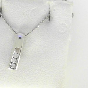 Diamond Pendant/Necklace 
14 Karat White Diamond Pendant 
Gram Weight 1.78 Chain Style: Cable Link 14 Karat White Length: 18in 
3 Center Diamonds Shape: Round 0.09