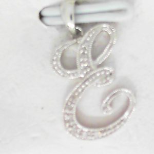 Diamond Pendant/Necklace 
14 Karat White Diamond Pendant 
 
9 Center Diamonds Shape: Round 0.05