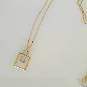 Diamond Pendant/Necklace
10 Karat Yellow/White Diamond Pendant
Chain Style: Box 10 Karat Yellow Length: 18in
18 Center Diamonds Shape: Round 0.12
