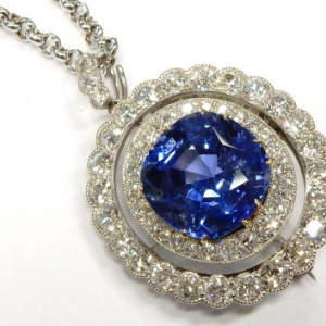 Estate Diamond Pendant/Necklace
Platinum White Estate Diamond Pendant
Gram Weight 10.27 Chain Style: No Chain
1 Center Sapphire 11.25ct Shape: Cushion; Clarity: VVS; Colour: Blue GIA 1206071756 With 51 Round Diamonds 3.40 ctw 14.65