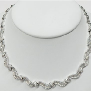 Estate Diamond Pendant/Necklace
18 Karat White Estate Diamond Pendant
Gram Weight 32.5
366 Center Diamonds Shape: Round; Clarity: SI-I1; Colour: G/H With 147 Baguette Diamonds 6.60 ctw 9.88