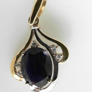 Estate Diamond Pendant/Necklace
18 Karat Yellow Estate Diamond Pendant
Gram Weight 7 Chain Style: No Chain
1 Center Sapphire 7.00ct Shape: Oval; Colour: Purple With 6 Round Diamonds 0.18 ctw 7.18