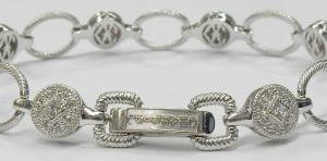 Charriol Estate Diamond Bracelet
18 Karat White Estate Diamond Bracelet Length: 7in
Gram Weight 16.1
72 Center Diamonds Shape: Round; Clarity: VS; Colour: I 0.5