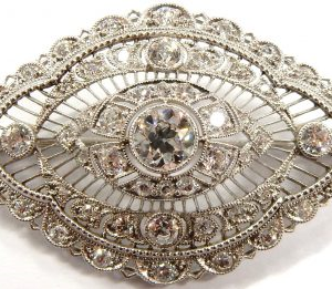 Estate Pins and Brooches
Platinum White Estate Pin/Brooch Gram Weight: 9.9
15 Diamonds 2.25tw Shape: Rose Cut Clarity: VS1 Colour: G