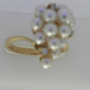 Pearls Ring
14 Karat Yellow Pearls Ring With Finger Size 6.75
Width 2.24mm Gram Weight 4.34
13 Center Pearls Shape: Round With 3 Round Diamonds 0.053 ctw