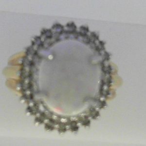 Opal Ring
14 Karat Yellow/White Opal Ring With Finger Size 6.25
Width 3mm Gram Weight 6.42
1 Center Opal Shape: Oval With 49 Round Diamonds 0.32 ctw