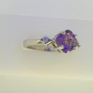 Amethyst Ring
14 Karat White Amethyst Ring With Finger Size 6.25
Width 2.7mm Gram Weight 3.8
1 Center Amethyst Shape: Fantasy Cut With 2 Round Diamonds