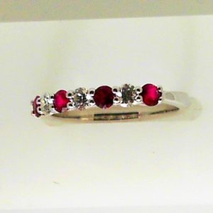 Rubies Ring
18 Karat White Rubies Ring With Finger Size 6.5
4 Center Rubies Shape: Round With 3 Round Diamonds 0.24 ctw