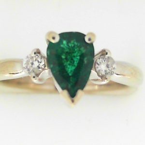 Emerald Estate Ring 
14 Karat White Emerald Ring With Finger Size 6 
Width 2.41mm Gram Weight 3.4 
1 Center Emerald 0.60ct Shape: Pear With 2 Round Diamonds 0.09 ctw