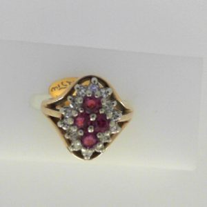 Rubies Estate Ring
14 Karat Yellow/White Rubies Ring With Finger Size 4.25
Width 2.05mm Gram Weight 5.43
4 Center Rubies Shape: Round With 14 Round Diamonds 0.25 ctw