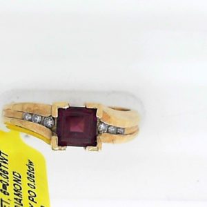 Garnet Estate Ring
10 Karat Yellow Garnet Ring With Finger Size 6.75
Width 2.25mm Gram Weight 3.07
1 Center Garnet Shape: Princess With 6 Round Diamonds 0.06 ctw